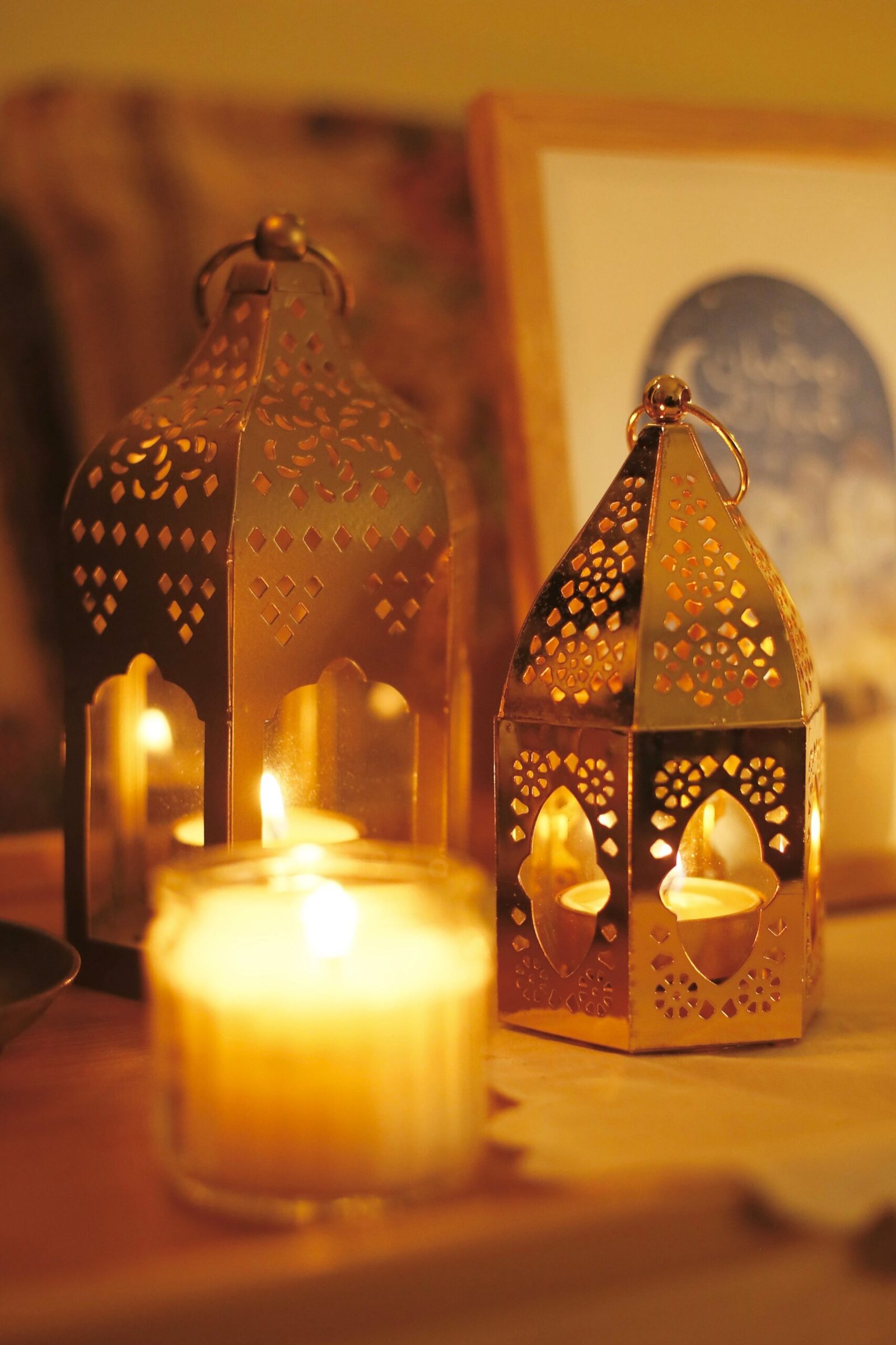 Candlelit Moroccan lanterns casting a warm evening glow